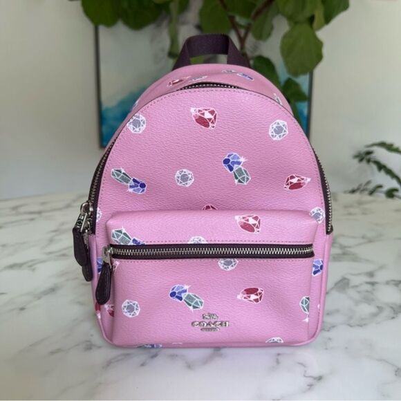 Coach Handbags - NWOT Disney X Coach Mini Charlie Backpack w/ Snow White Tulip Multi Gems F72817